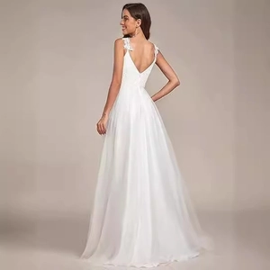 Elegant white A-line wedding dress with deep V-neck, lace embroidery, and open back