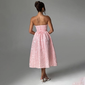 Detailed back view of pink jacquard dress showing backless design with adjustable lace-up ties