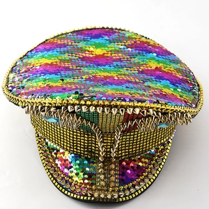 Close-up of rainbow sequins and golden metal spikes on a punk style captain hat