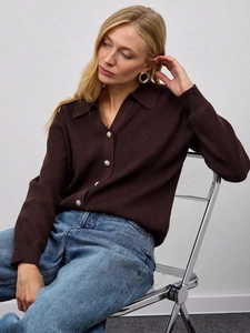 Elegant dark brown knit cardigan with polo collar and gold buttons on a model