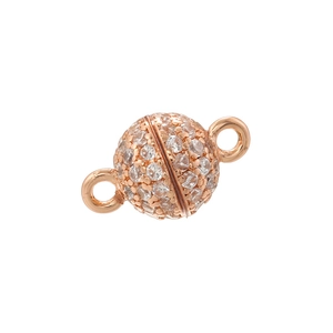 Macro shot of rose gold magnetic jewelry clasp paved with sparkling cubic zirconia