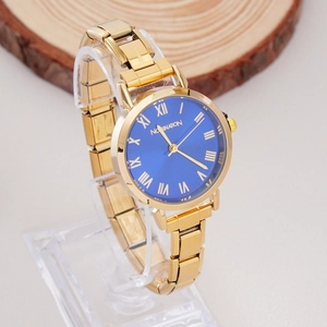 Detail of gold women's watch with blue Roman dial and stainless steel links