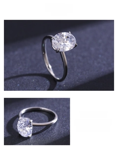 Macro shot of oval cut cubic zirconia ring with classic four-prong silver setting