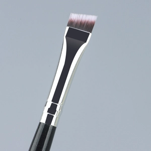 Pinceau biseauté pour sourcils avec poils synthétiques et manche noir scintillant