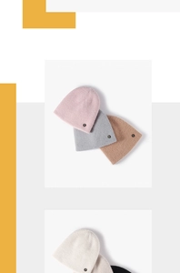 Detailed view of colorful knitted beanies featuring soft fuzzy texture and R letter patch