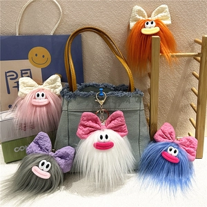 Portachiavi mostro di peluche brutto-carino con fiocchi in cinque colori per borse e regali