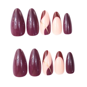 Almond shaped press-on nails in purple and nude tones with elegant gold striped patterns