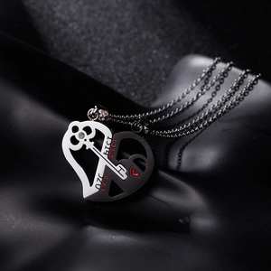 Macro shot of stainless steel 520 1314 heart necklaces with key and lock symbols