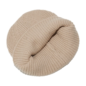 Close-up of beige ribbed knit beanie with soft texture and wide folded cuff detail