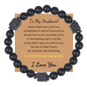 Detail of black matte bead bracelet with lava stones on a 'To My Husband' gift card
