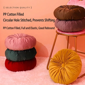 Handmade velvet pumpkin floor pillows in multiple colors with center tufted detail