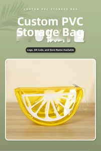 Detail view of yellow PVC toiletry bag with lemon print, zipper, and side handle