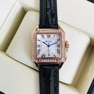 Square rose gold watch with sparkling crystal bezel and black leather strap in box
