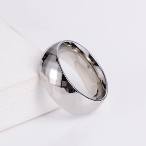 Polished silver stainless steel Mobius ring with geometric diamond pattern on stone