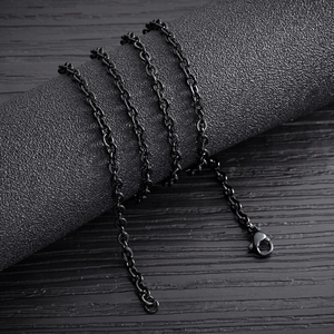 Detail of minimalist black stainless steel cable chain necklace with lobster clasp closure