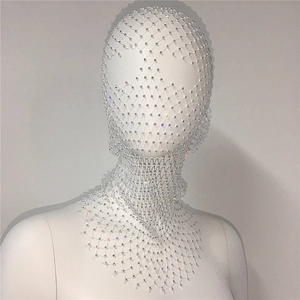 Detail of white mesh headpiece with sparkling rhinestones on an elegant mannequin head