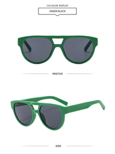 Detail view of fashion green double-bridge sunglasses with dark grey UV-protection lenses