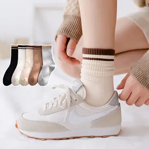 Unisex mid-calf cotton sports socks with classic stripes in black white and gray
