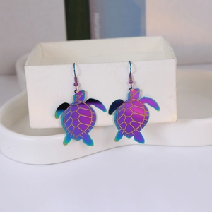 Iridescent sea turtle drop earrings with colorful gradient finish and golden line details