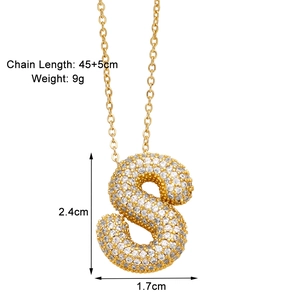 Macro shot of gold S-letter pendant with zircon inlay and detailed size specifications