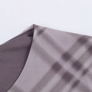 Detailed close-up showing purple tie-dye mesh fabric texture and precise stitching on collar