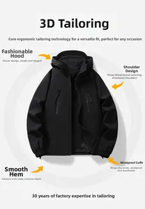 Detail of windproof cuffs and 3D ergonomic tailoring on a black outdoor jacket