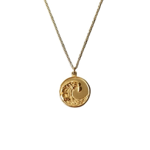 Elegant 18K gold plated stainless steel necklace featuring a 3D wave relief coin pendant