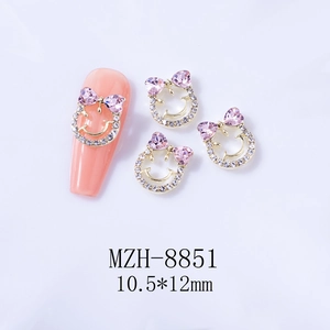 Charme d'ongle avec nœud et cœur rose serti de strass de taille 10,5x12mm