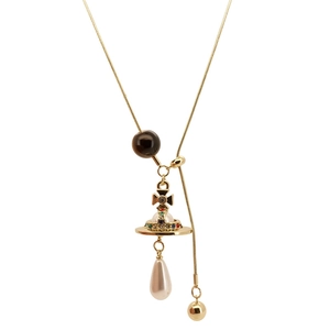 Tiger eye beaded cross pendant necklace with a golden orb and white teardrop pearl