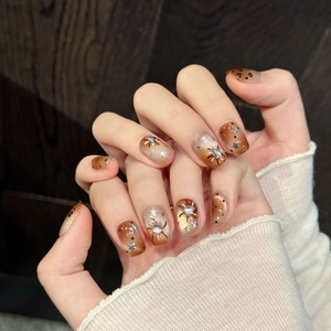 Handmade brown gradient press-on nails with cat-eye effect and star diamond accents