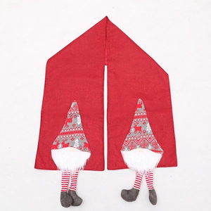 Festive red Christmas table runner featuring 3D faceless gnome decor with long striped legs