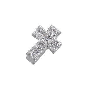 Macro shot of silver cross charm with micro-pave cubic zirconia for DIY jewelry making