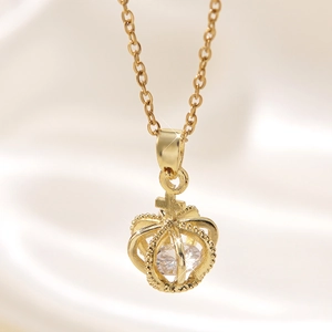 Golden stainless steel necklace featuring a hollow crown pendant with a sparkling zircon