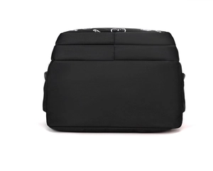 Close-up of black nylon backpack back with white Cutie text and cartoon print