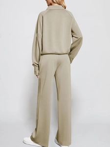 Rear view of women's two-piece sage green sweatshirt and high waist wide leg pants set