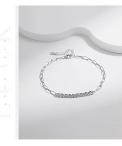 Detail of S925 sterling silver chain bracelet with shiny zircons and adjustable clasp
