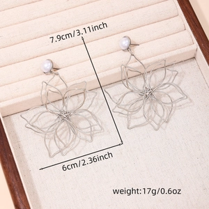 Detailed view of silver woven flower earrings with pearls and dimensions marked