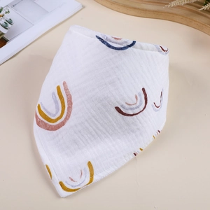 Close-up of soft double-layer cotton gauze baby bib with colorful rainbow pattern print