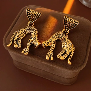 Vintage gold leopard earrings with black spots and geometric triangular pendants