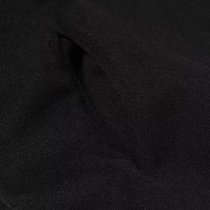 Manteau en laine de style britannique noir avec ourlet contrasté et détail de poche