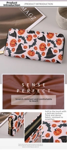 Detail of Halloween PU leather wallet with pumpkin prints and smooth metal zipper closure