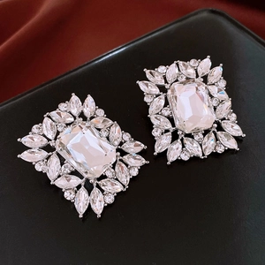 Macro view of crystal teardrop earrings featuring marquise and round cut rhinestones