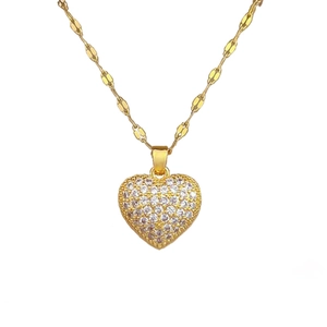 Luxurious gold heart pendant necklace with shimmering zircon pavé and unique chain link