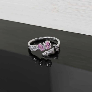 Close-up of pink marquise stones and white zircon on silver adjustable leaf ring