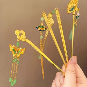 Traditional Chinese hair sticks with green beads and tassels in elegant gold finish