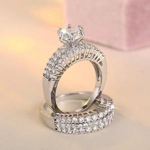 Elegant two-piece engagement ring set with luxury cubic zirconia in silver-tone finish
