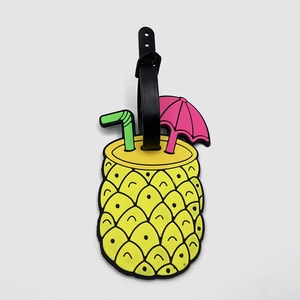 Detail view of pineapple-shaped PVC luggage tag with 3D straw and umbrella design
