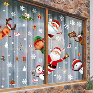 Christmas window stickers with Santa, reindeer, and snowflakes on a glass pane decor