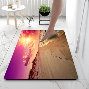 Detail of diatom mud bath mat showing quick-dry absorbent surface with sunset beach print