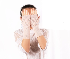 Close-up of beige knit long fingerless gloves featuring hollow leaf texture and ribbed cuffs